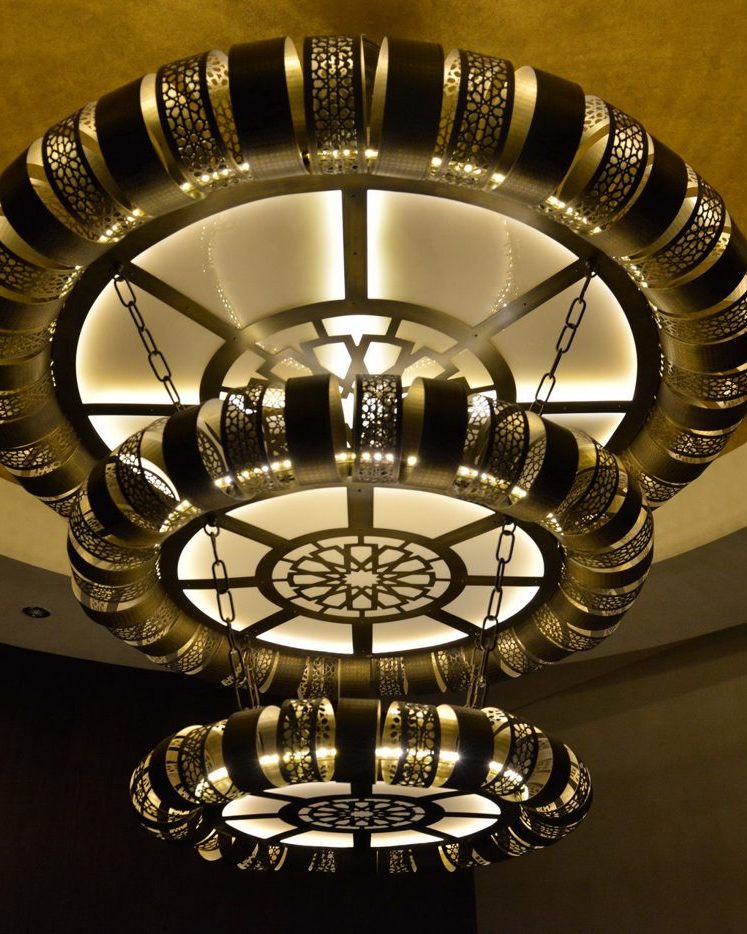 Bespoke tiered brass chandelier by Beacon